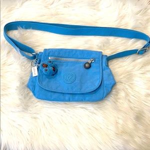 A blue Kipling purse